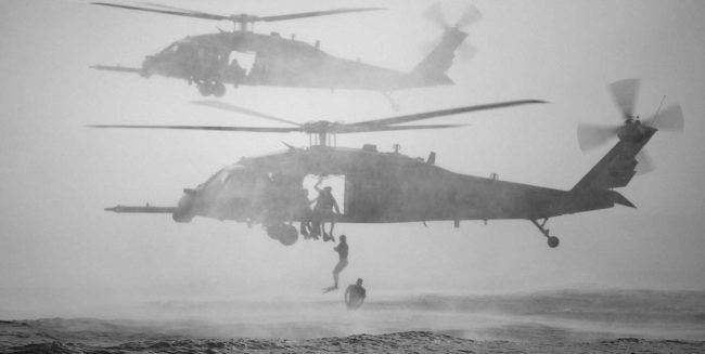 Two HH-60 Pave Hawk helicopters delivery Navy SEALS offshore